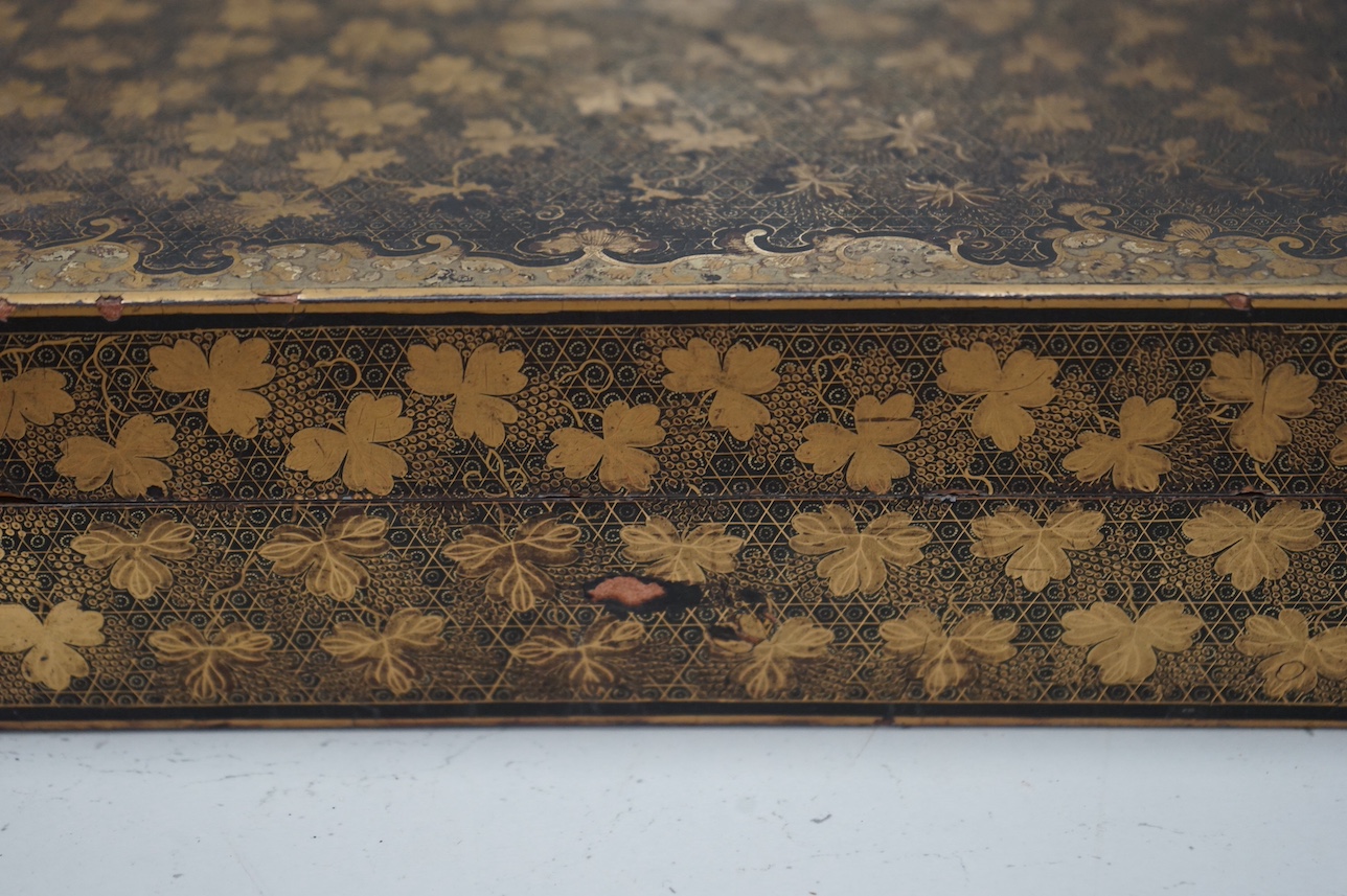 A mid 19th century Chinese gilt decorated and black lacquer games box, with five internal gilt and lacquered boxes, 30cm wide x 26cm deep. Condition - outer box split to top, gilding worn, edges worn, interior boxed as n